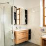 Bathroom, © Georg Pomassl Modern bathroom with wooden furniture, large window front and glass shower.