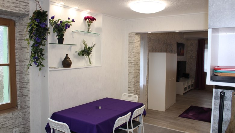 House Danube Dining area, © Haus Donau, Hr. Benesics Purple table with white armchairs