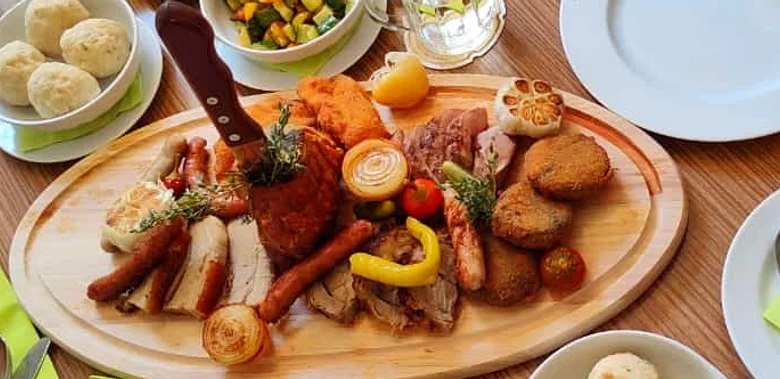 Dish on a wooden board with knife