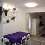 Purple table with white armchairs
