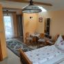 Room with bed, table and 2 chairs