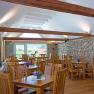 Dining room with wooden tables and chairs