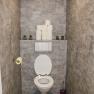 Modern WC with gray tiles